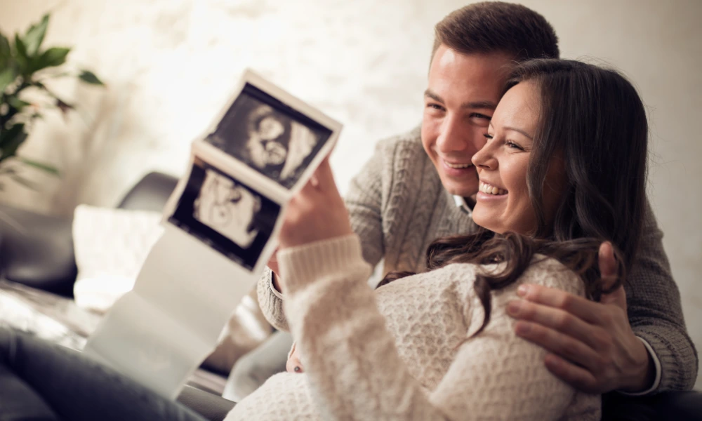 happy-couple-pregnant A happy couple looking at pregnancy ultrasound images