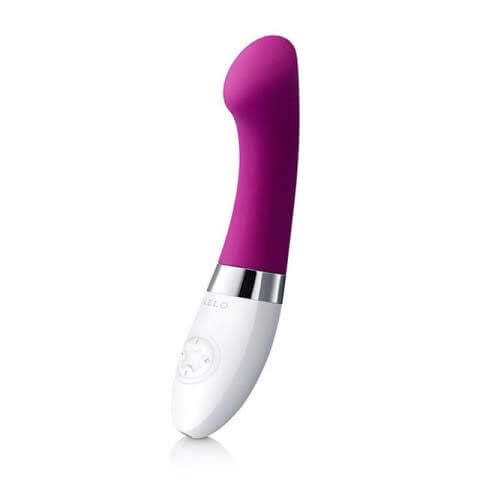 handheld vibrator with a long shaft and wide flat tip in pink, white base contains control buttons