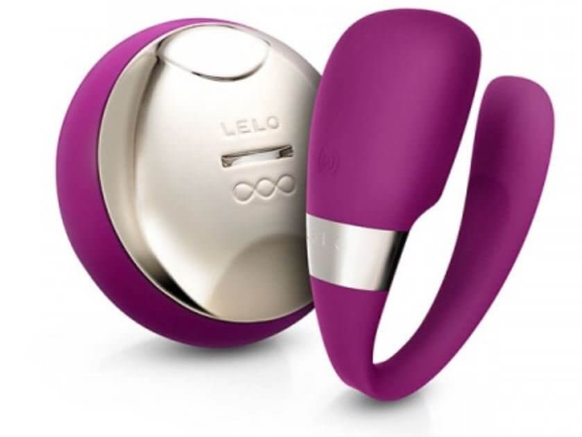 Purple U-shaped vibrator with metallic band and separate circular remote control with metallic front