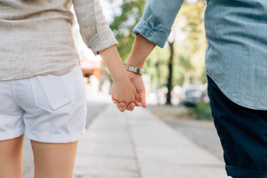 Image of partners holding hands