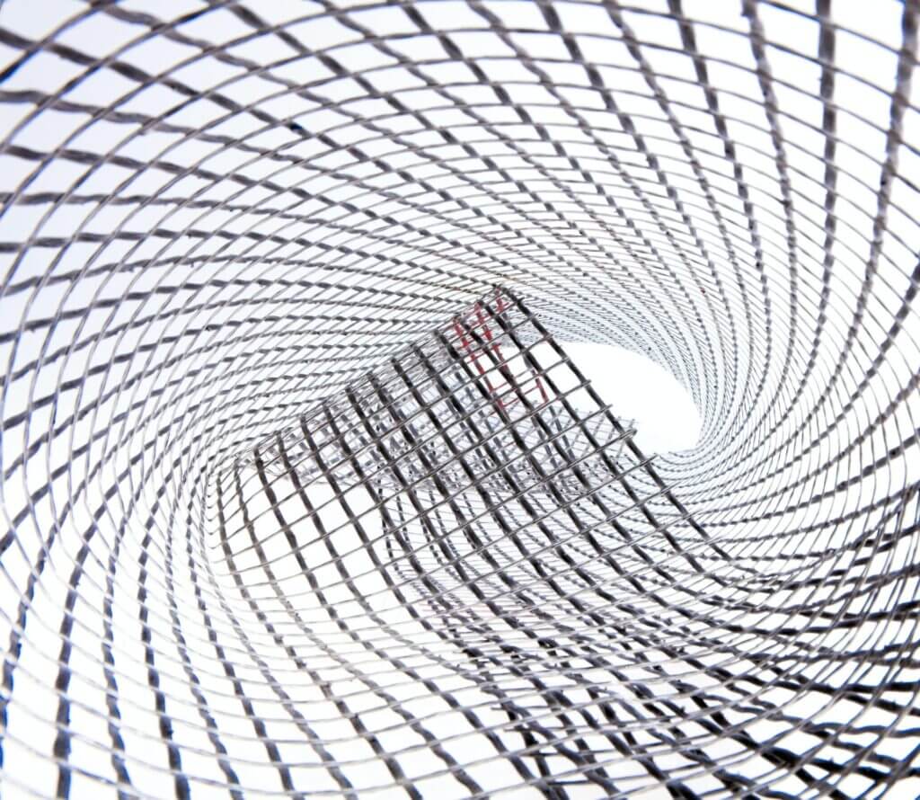 White background close up image of flexible silver colored metal wire mesh