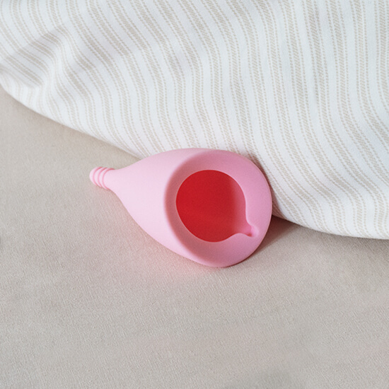 pink cone shaped sustainable menstrual cup
