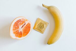 Banana, Orange, and Condom sit together to represent how STIs affect the body and mind