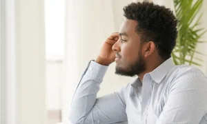 Man looking away in deep thought
