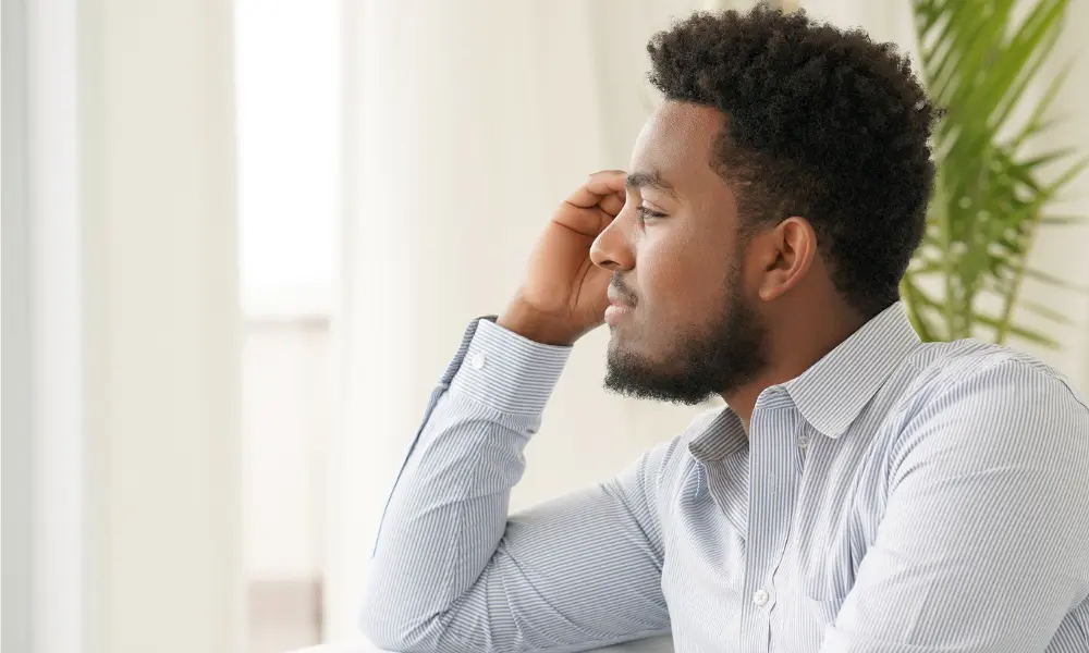 Man looking away in deep thought