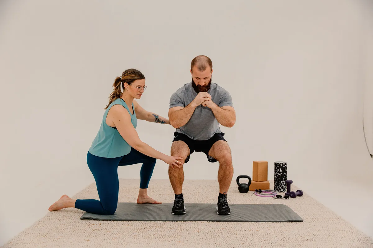 Laura-Meihofer-2937 A physical therapist leads their patient through exercise