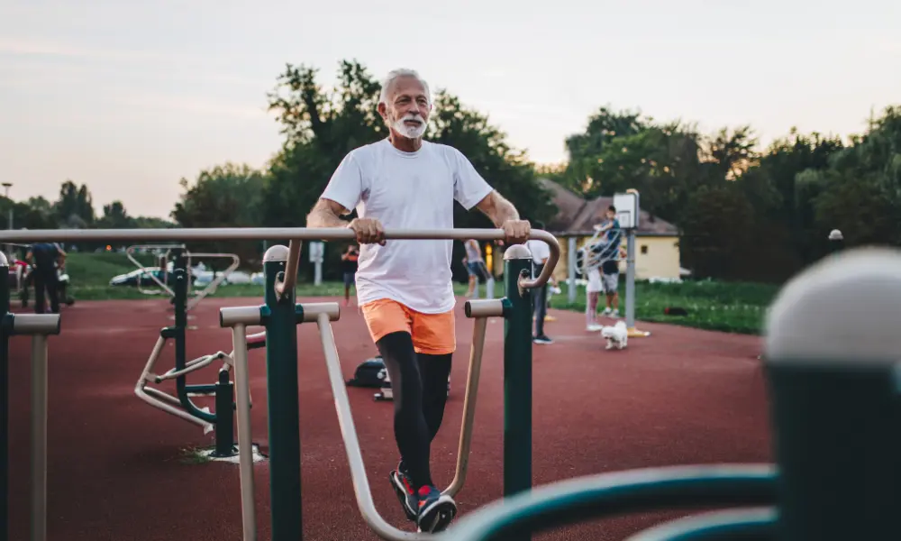 A man works out at an outdoor gym