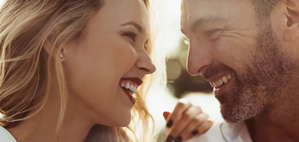 Couple smiling at each other lovingly