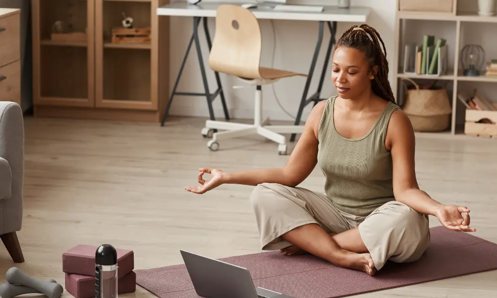 Woman participating in yoga for managing her menopause symptoms