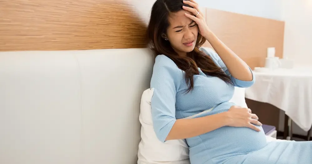 Pregnant woman looking tired and frustrated